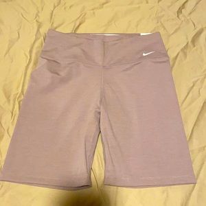 Nike tight fit, midrise 7” length dri-fit spandex shorts.